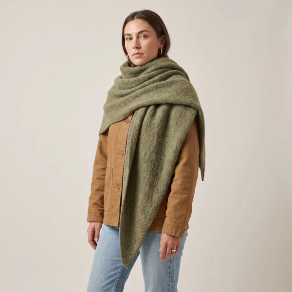 Moss green asymmetric heavyweight scarf styled with camel jacket and jeans