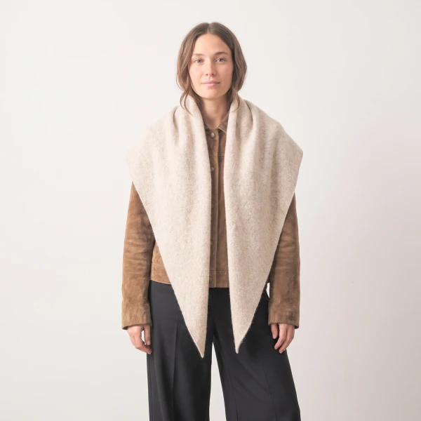 Beige asymmetric heavyweight scarf styled over brown jacket